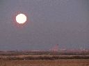 puesta-luna-llena-carretera-lillo.gif